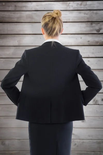 Businesswoman standing with hands on hips