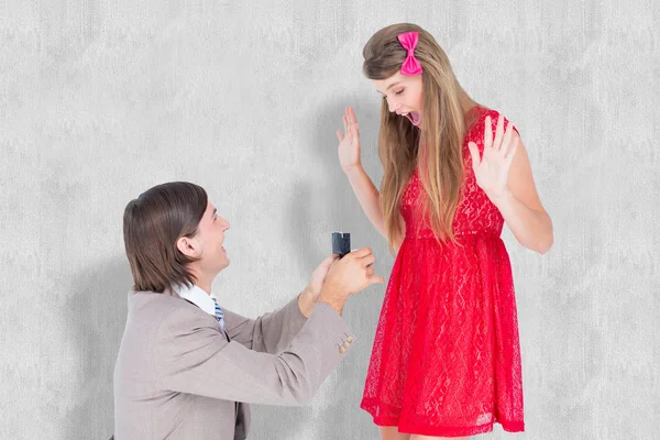 Hipster on bended knee doing a marriage proposal
