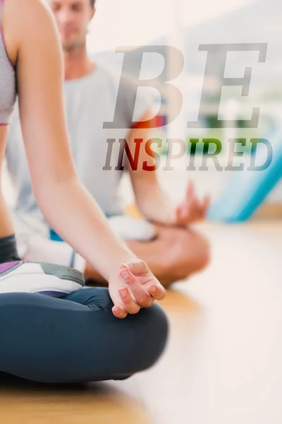 Cropped couple in meditation pose at fitness