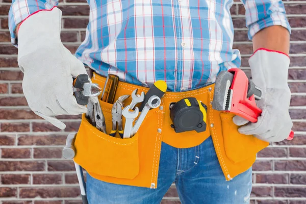 Handyman holding hand tools