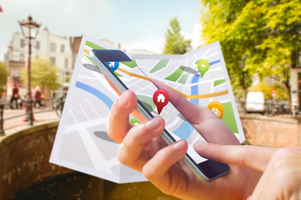 Composite image of man using map app on phone