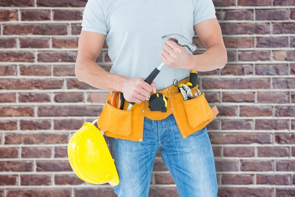 Worker holding hammer
