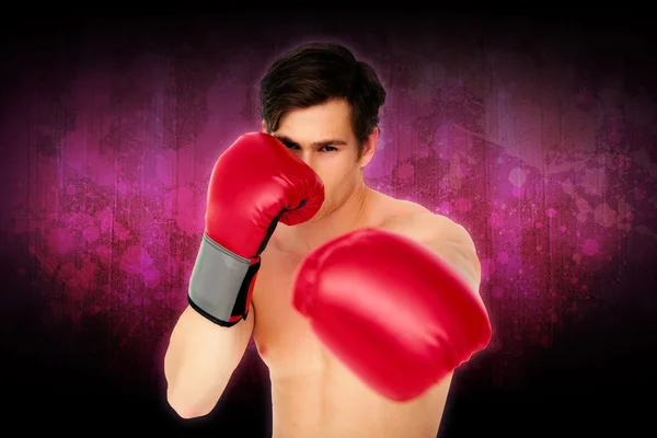 Tough man wearing red boxing gloves