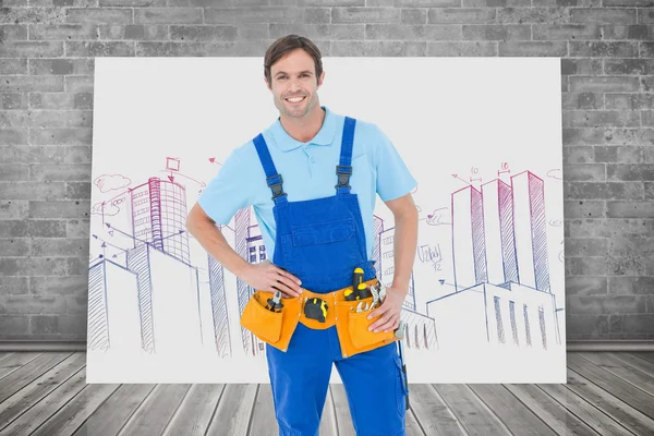 Confident carpenter with hands on hip