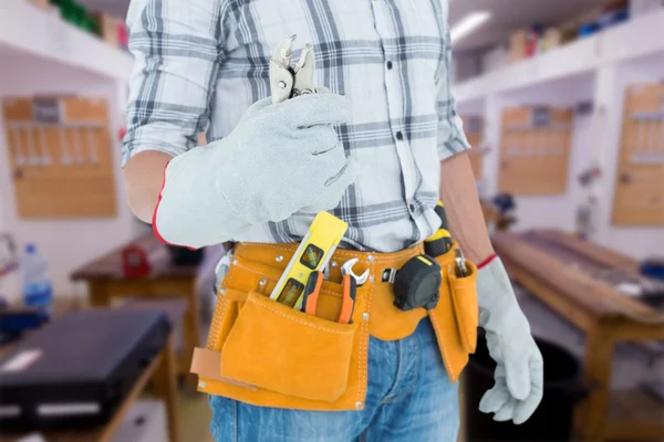 Technician with tool belt around waist