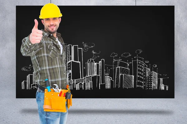 Confident manual worker gesturing thumb up