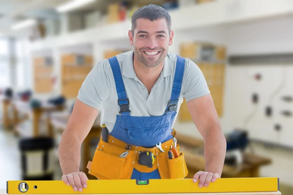 Worker using spirit level