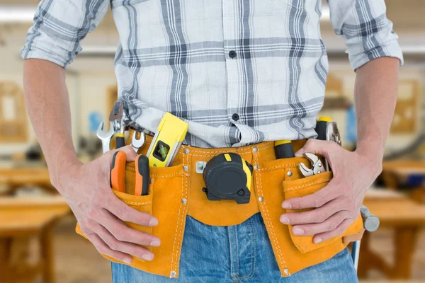 Technician with tool belt around waist