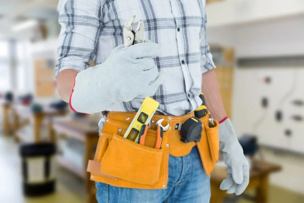 Technician with tool belt around waist