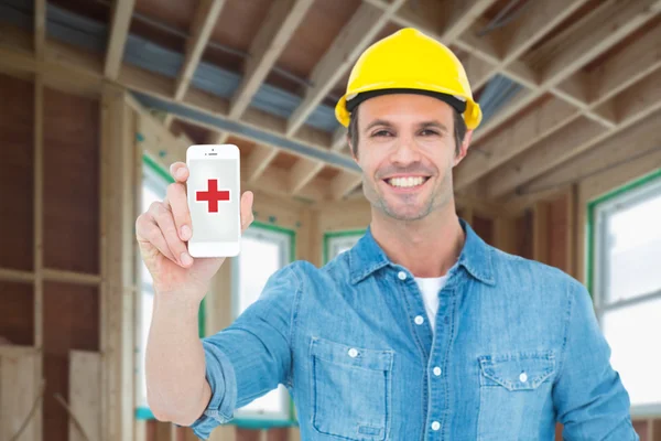 Happy carpenter showing smart phone