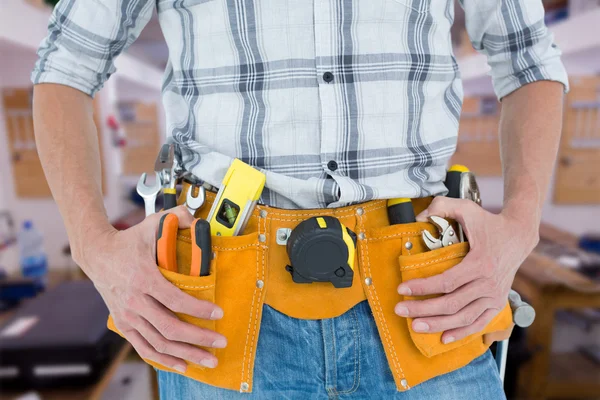 Technician with tool belt around waist