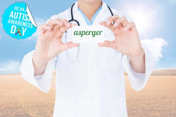 Word asperger and doctor holding card