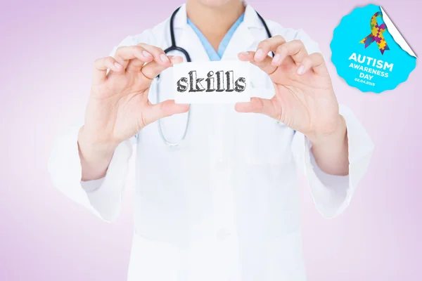 Word skills and doctor holding card