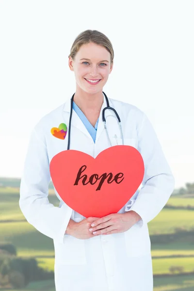 Word hope and doctor holding card