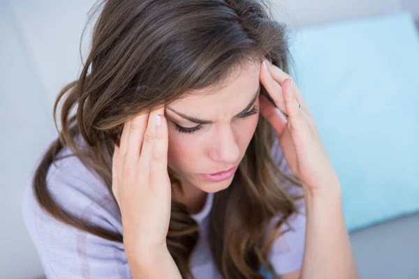 Woman suffering from head ache