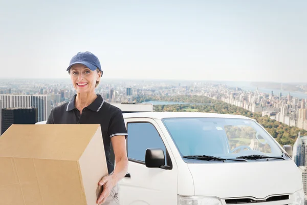 Happy delivery woman holding cardboard box