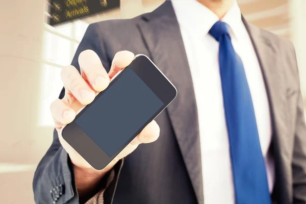 Businessman showing his smartphone screen