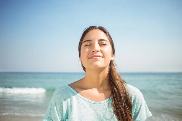 Woman smiling at camera at beach