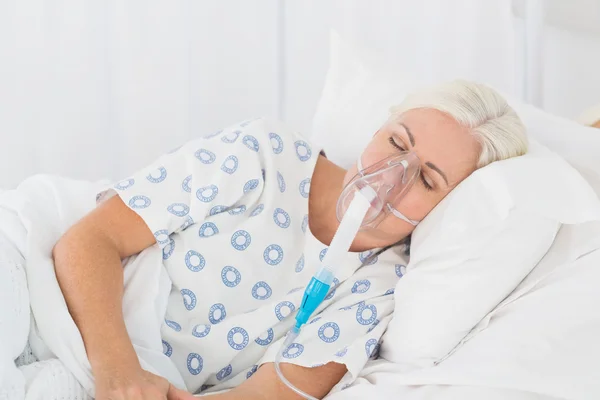 A patient with an oxygen mask