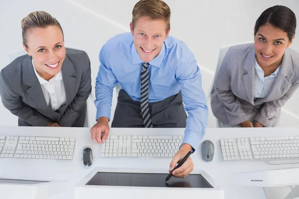 Businessman showing his screen to the team