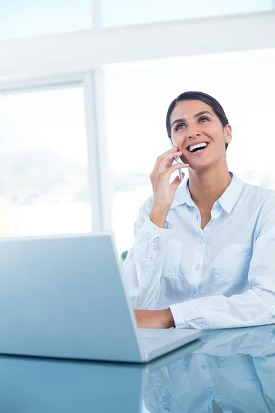 Smiling businesswoman having a phone call