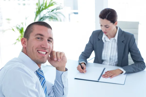 Businesswoman conducting an interview with businessman