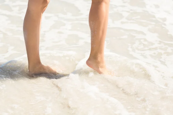 Close up view of woman foot on water
