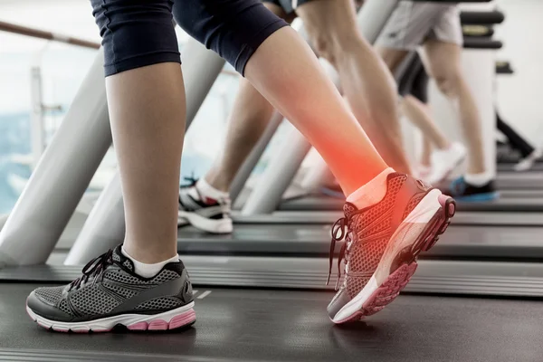 Highlighted ankle of woman on treadmill