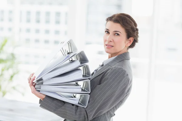 Businesswoman holding files