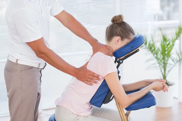 Woman having back massage