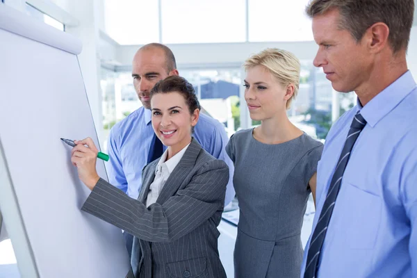 Business people looking at conference board