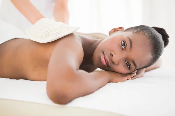 Woman enjoying massage at spa