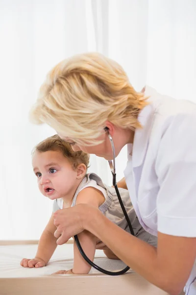 Doctor with stethoscope and child