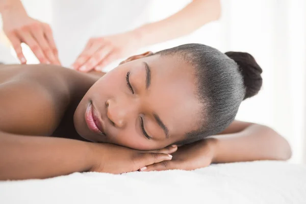 Woman enjoying massage at spa