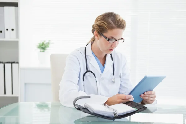 Doctor looking at tablet pc