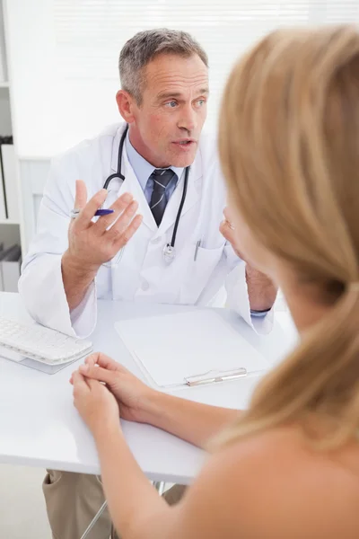 Doctor giving patients test results