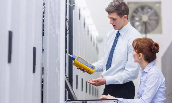 Technicians using digital cable analyser