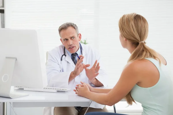 Doctor giving patients test results