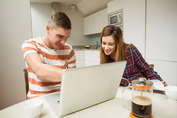 Couple looking at laptop