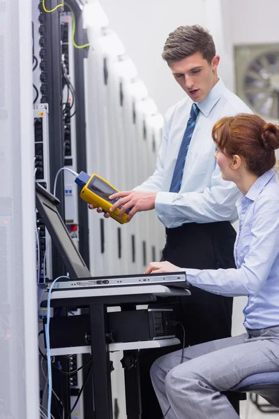 Technicians using digital cable analyser