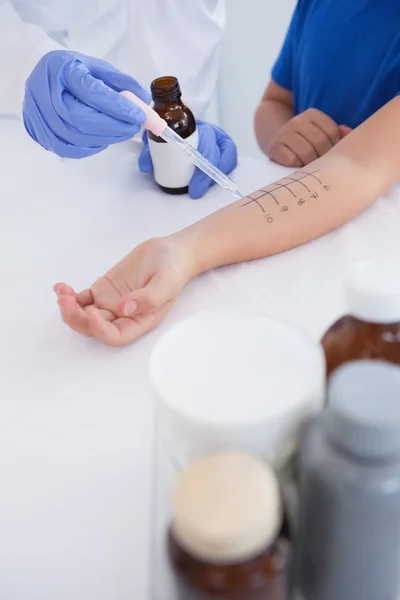 Doctor performing skin prick test