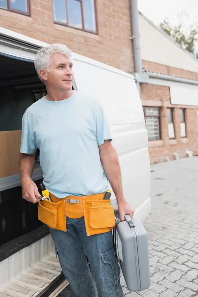 Man with tool belt and briefcase