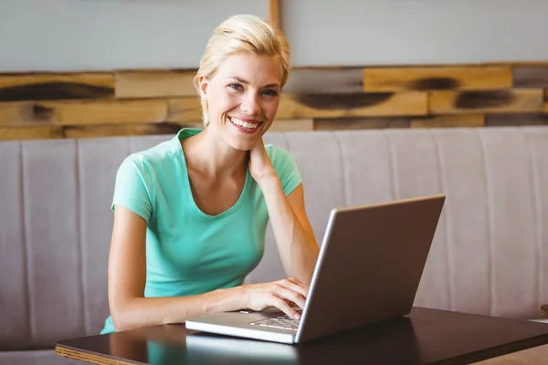 Happy pretty blonde using computer