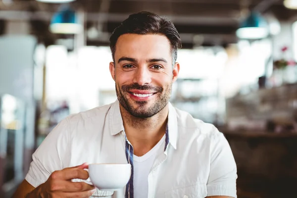 Handsome man having a coffee