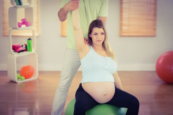 Pregnant woman having relaxing massage