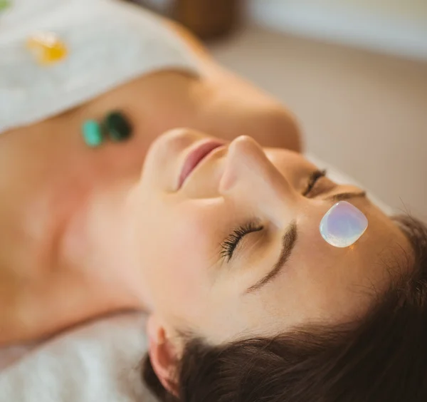 Young woman at crystal healing session