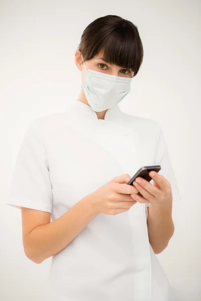 Nurse using her mobile phone