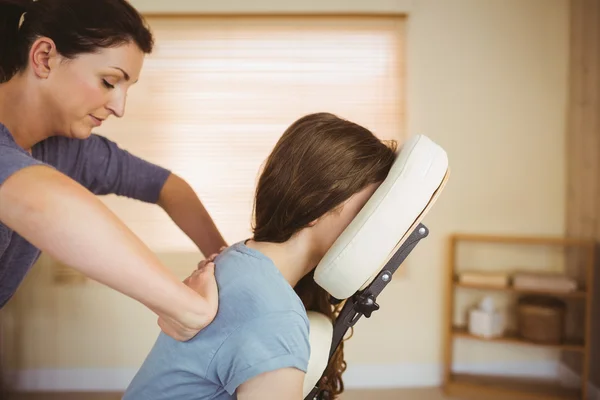 Woman getting massage in chair