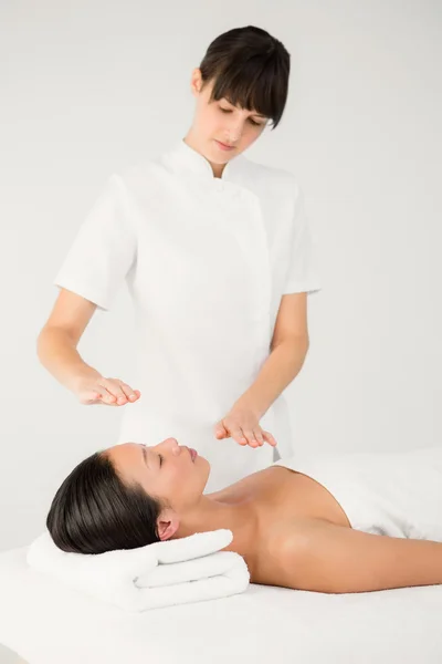 Woman receiving alternative therapy
