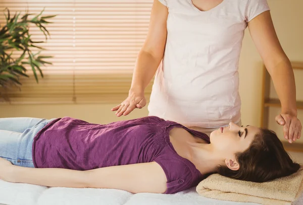 Young woman having a reiki treatment